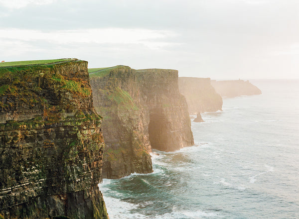 Sara Donaldson Fine Art Print | Vista Series | "Cliffs of Moher" | The majestic Cliffs of Moher just after a gentle rain. Murky skies with vibrant greens. Medium format film photograph on Fuji 400h.