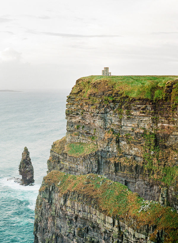 Sara Donaldson Fine Art Print | Vista Series | "O'Brien's Tower" | O'Brien's Tower, perched atop the Ireland cliffside. Murky skies with vibrant greens and a moody turquoise ocean. Medium format film photograph on Fuji 400h.